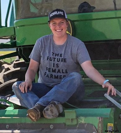 Montana farmer Michelle Jones sits on her combine
